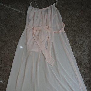 Peach colored bridesmaid-style maxi dress